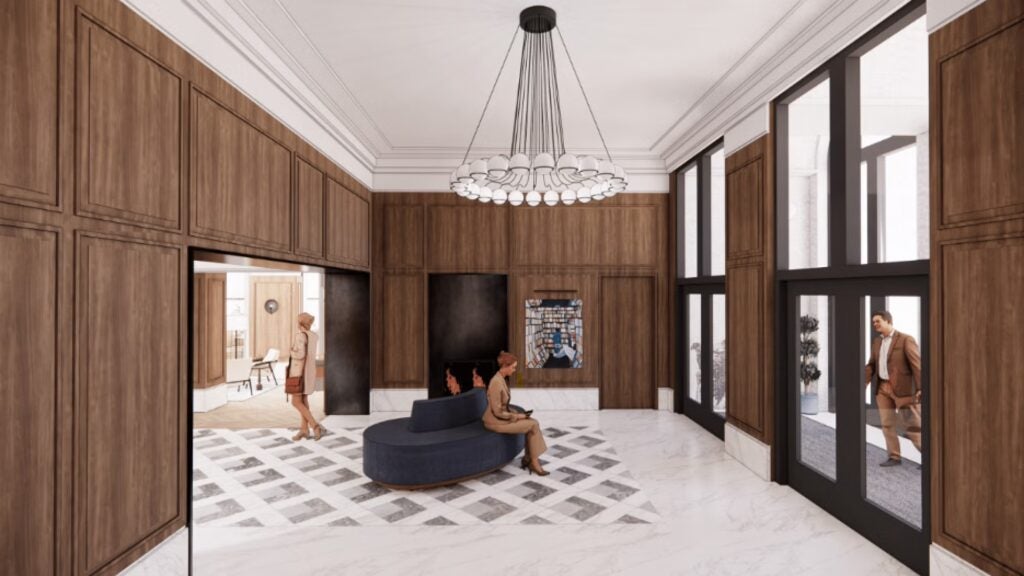 rendering of future hotel lobby with wood panels and modern chandelier