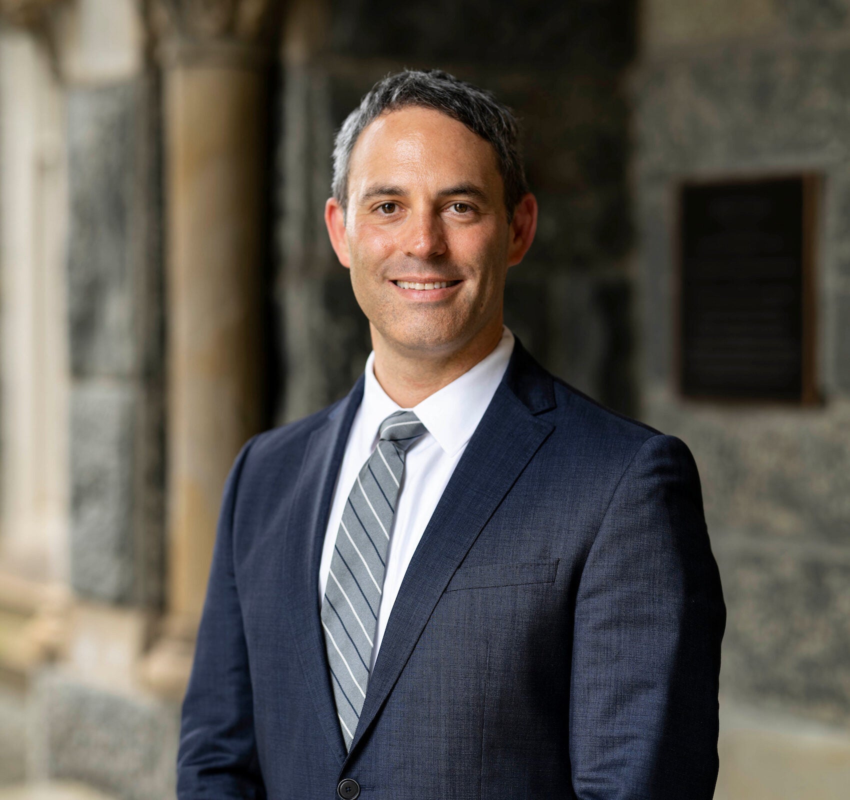 headshot of Josh in a suit and tie